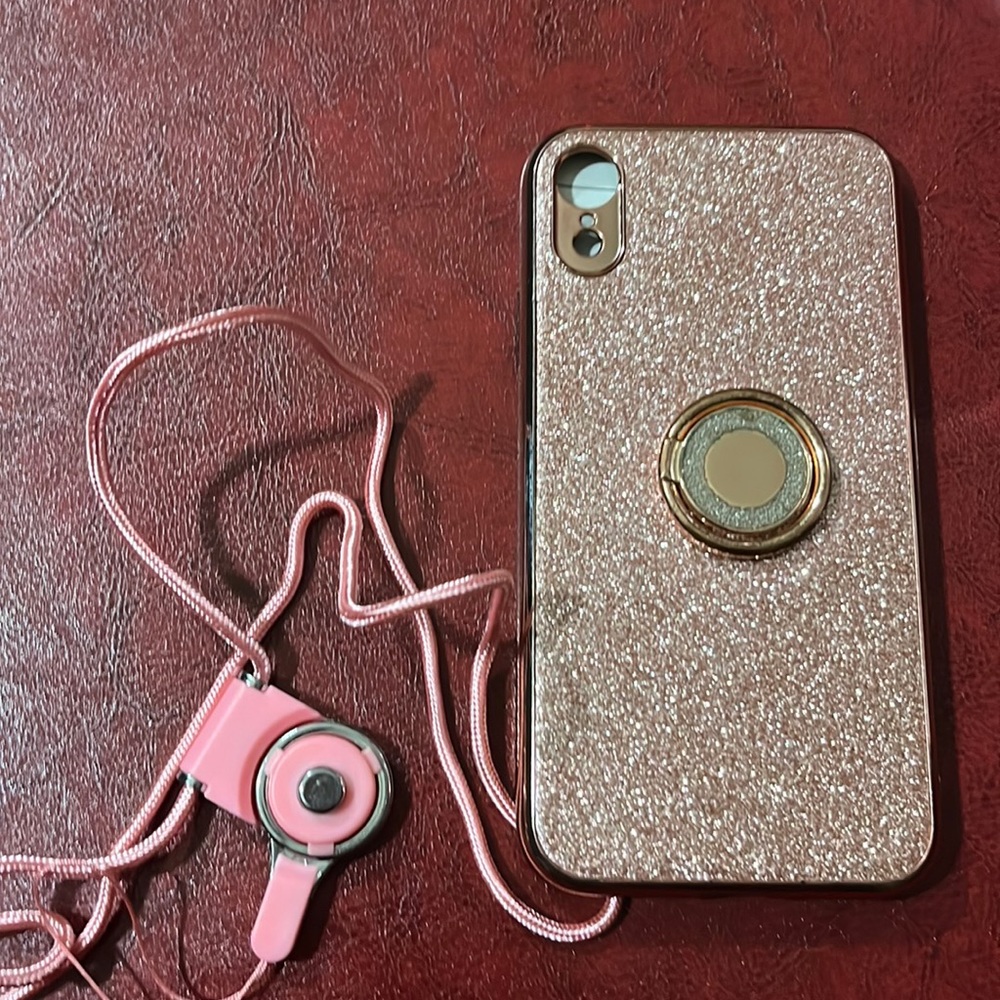 Cyclone XR iPhone Pink Glitter phone Case with ring stand attached to back